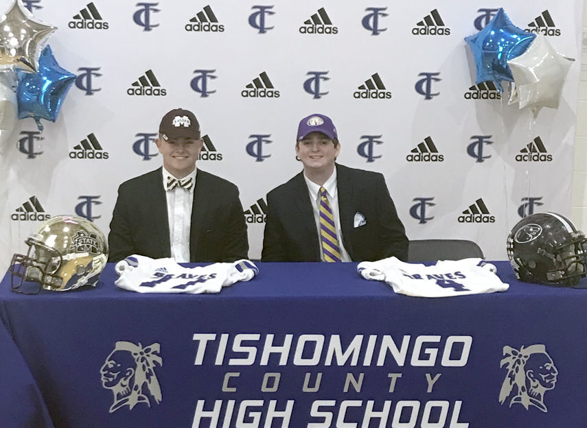 Two Braves sign football scholarships